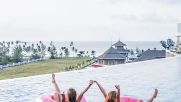 Outdoor pool, pool umbrellas, sun loungers