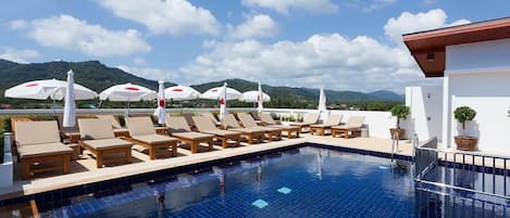 Outdoor pool, open 8:00 AM to 6:00 PM, pool loungers