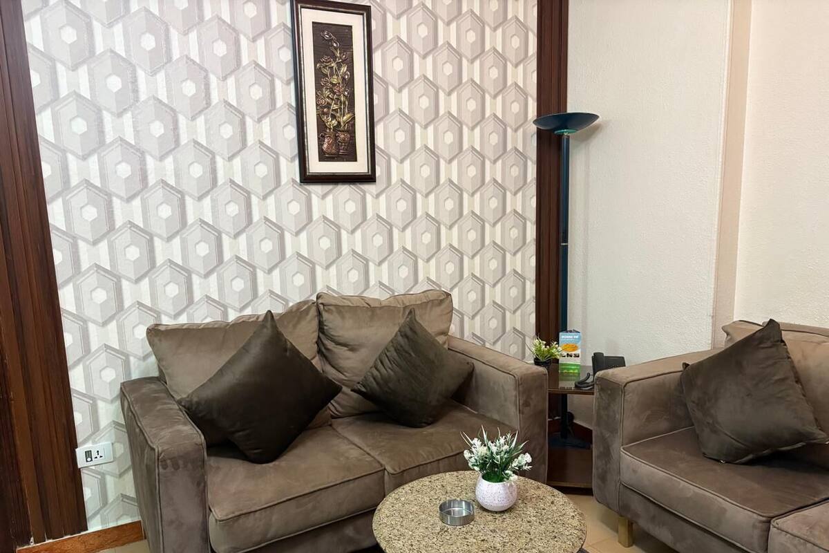Deluxe Suite, 2 Bedrooms | Living area | LED TV