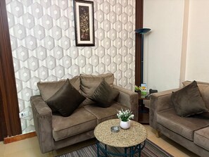 Deluxe Suite, 2 Bedrooms | Living area | LED TV - Bonne Vie Hotel (6th of October City)