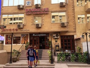 A building with a sign reading "Bonne Vie Rent Residential" and "Terrace Lounge" with a reception area. - Bonne Vie Hotel (6th of October City)