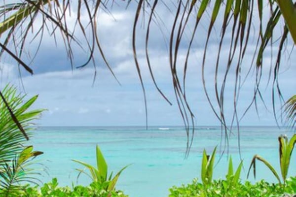 On the beach, white sand, sun loungers, beach umbrellas