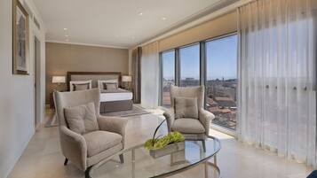 Luxury Suite | Living area | 40-inch flat-screen TV with cable channels, TV