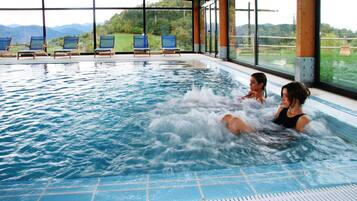 Indoor pool, outdoor pool, pool umbrellas, sun loungers