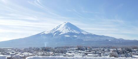 A snow-covered mountain with a clear sky.