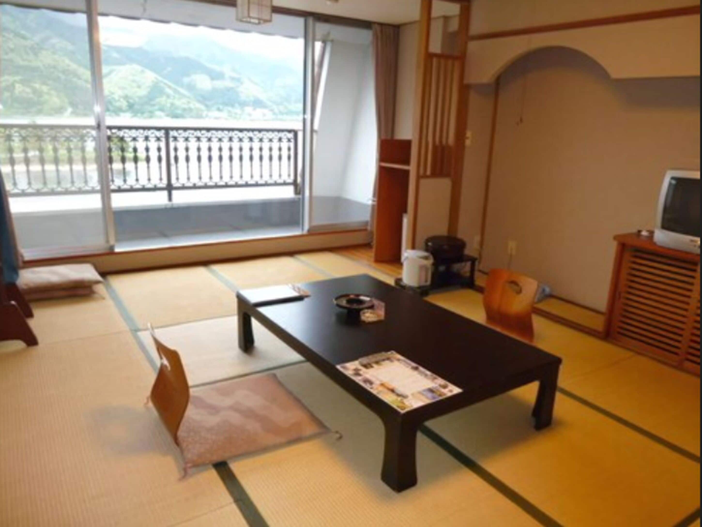 traditional room (lake view) | living area | tv