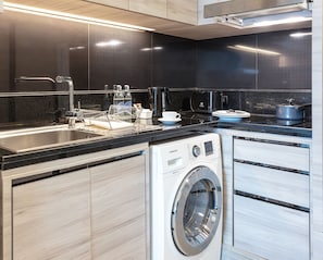 Suite, 1 Bedroom | Private kitchen | Full-size fridge, microwave, stovetop, cookware/dishes/utensils