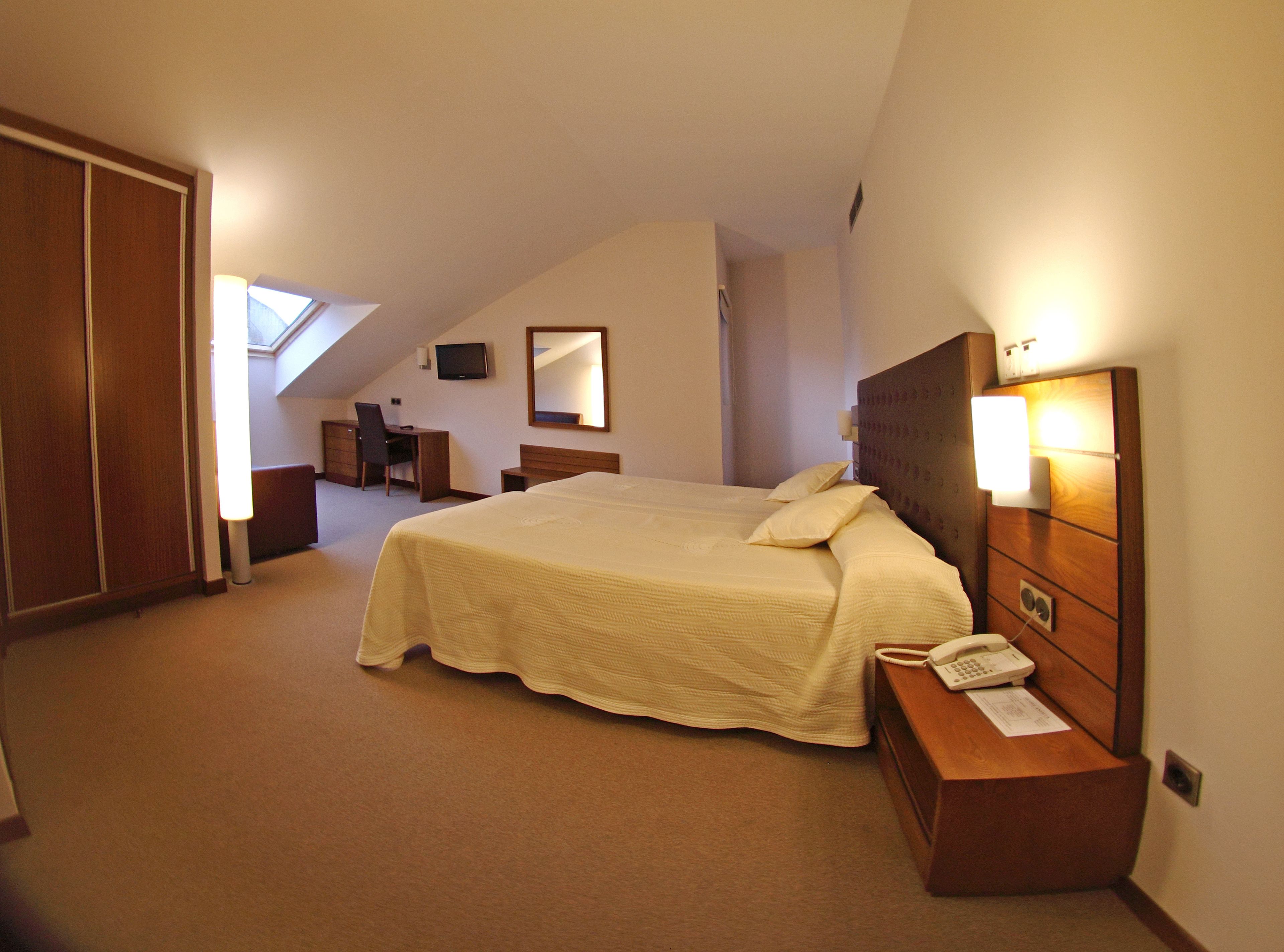 double or twin room | minibar, in-room safe, desk, laptop workspace