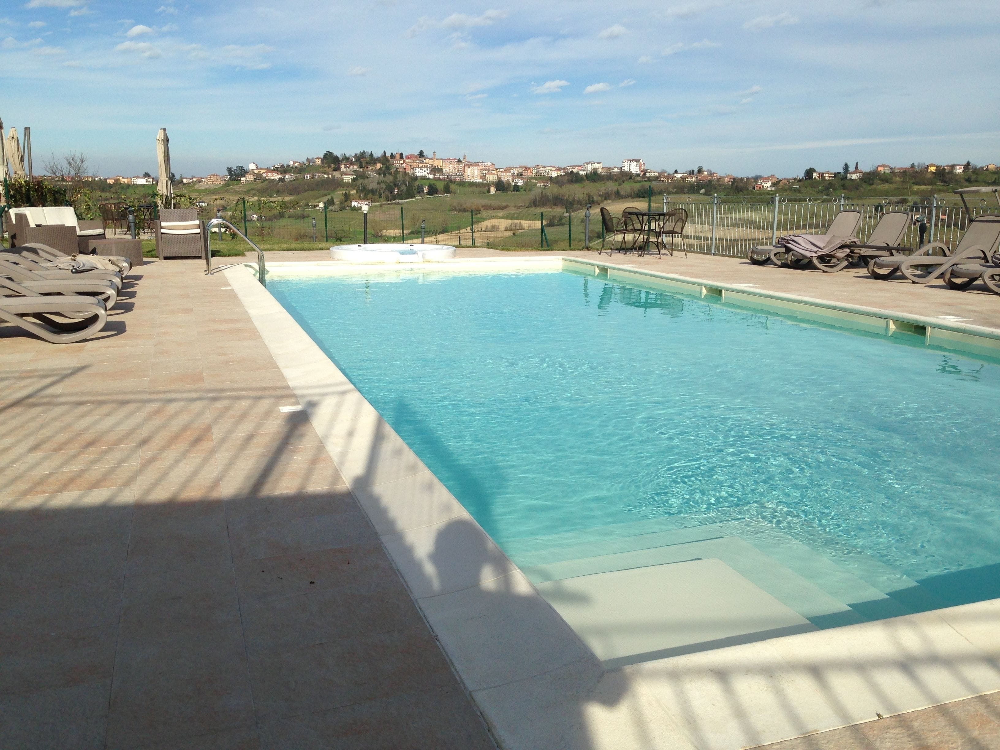 seasonal outdoor pool, pool umbrellas, pool loungers