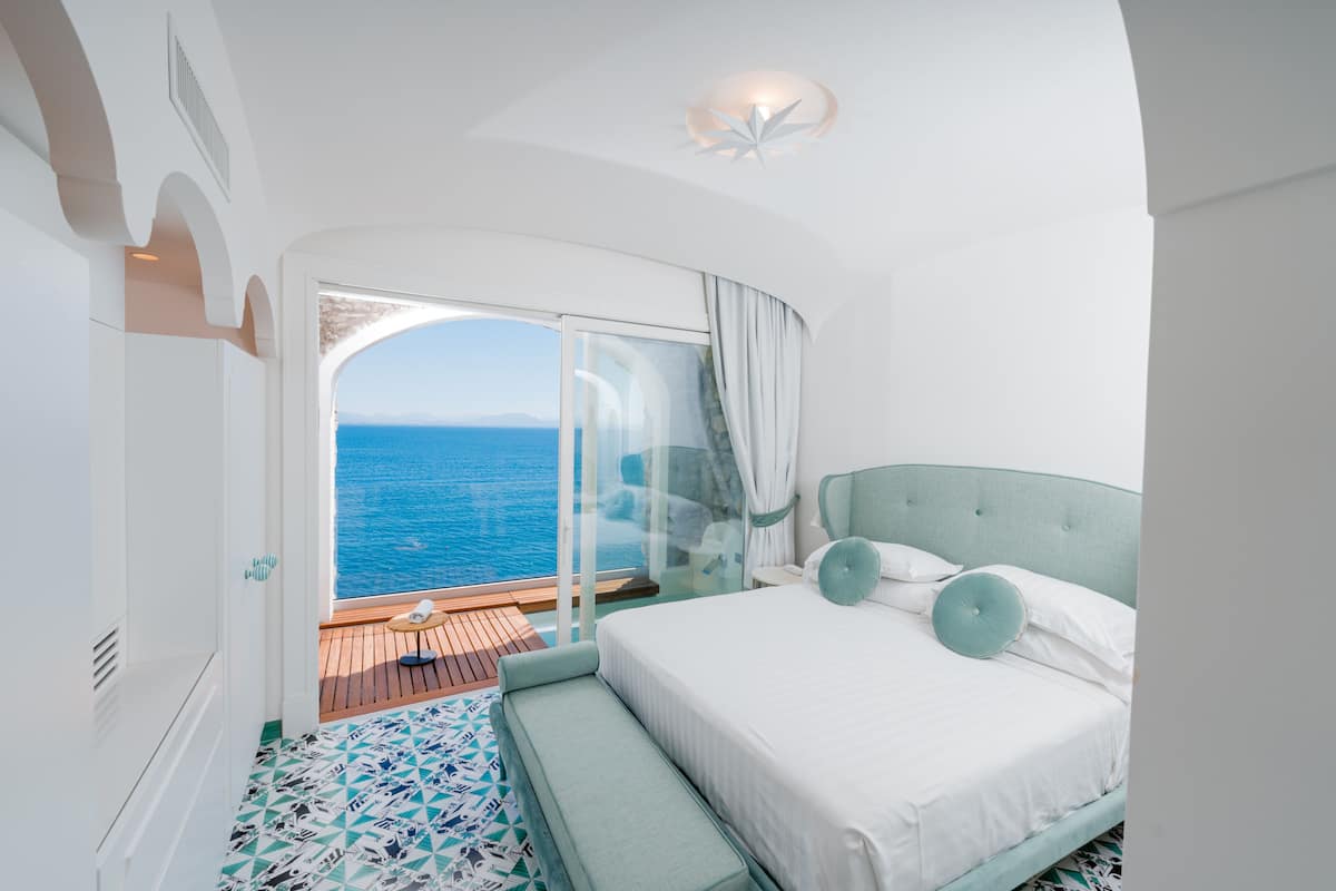 junior suite, 1 bedroom, jetted tub, sea view | 1 bedroom, minibar, in-room safe, desk