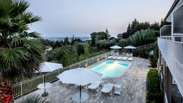 Outdoor pool, open 7:00 AM to 7:30 AM, pool umbrellas, sun loungers