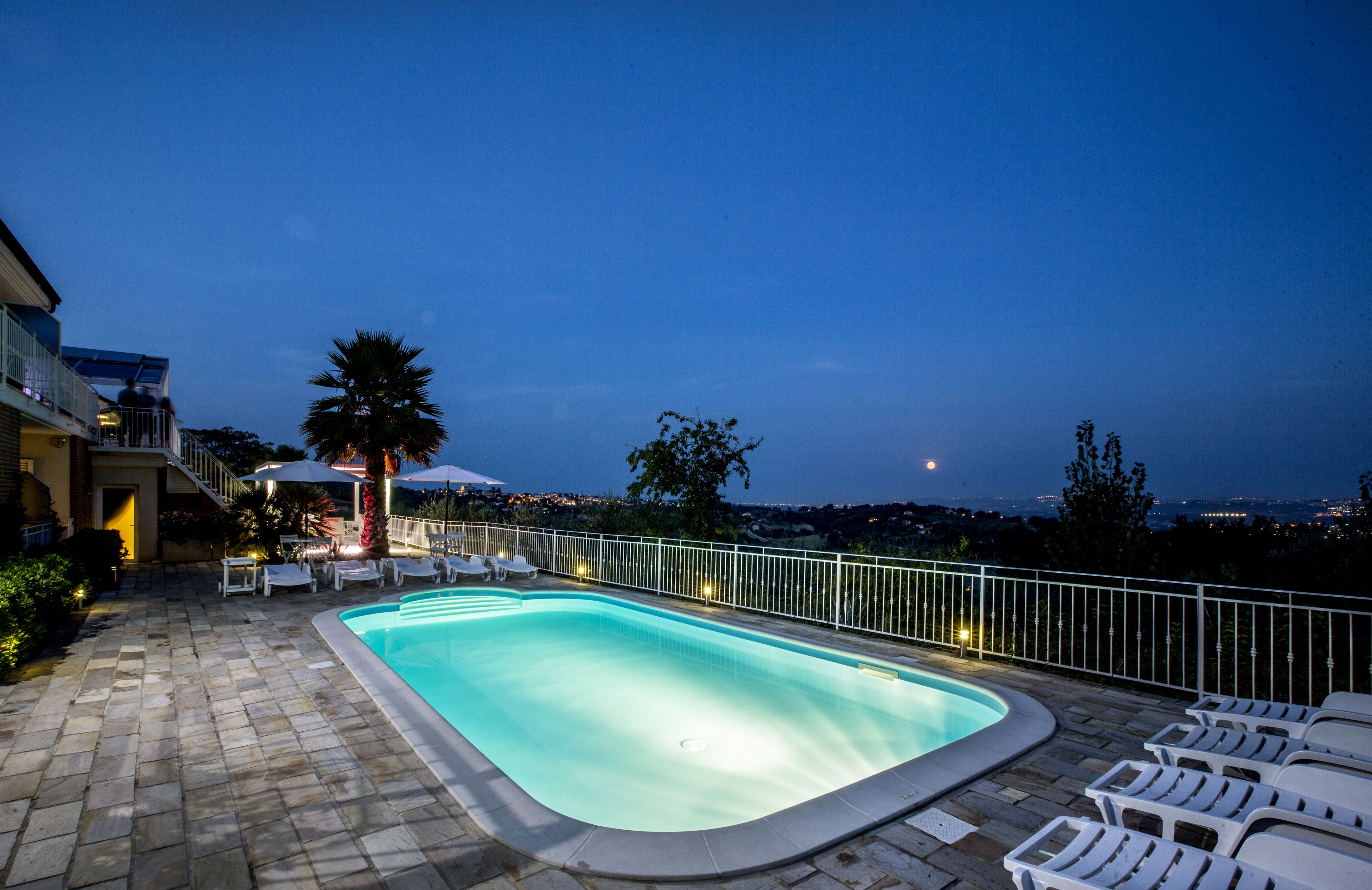 Outdoor pool, open 7:00 AM to 7:30 AM, pool umbrellas, pool loungers