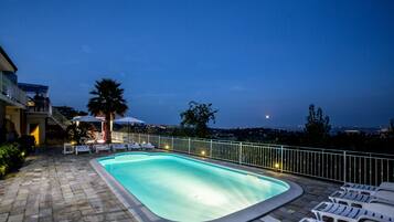 Outdoor pool, open 7:00 AM to 7:30 AM, pool umbrellas, pool loungers