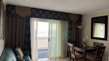 Deluxe Apartment, 1 Bedroom, Ocean View (Oceanfront) | Living area | Flat-screen TV