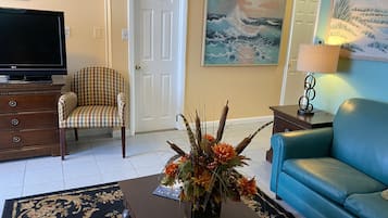 Deluxe Apartment, 3 Bedrooms, Kitchen (Oceanfront) | Living area | Flat-screen TV