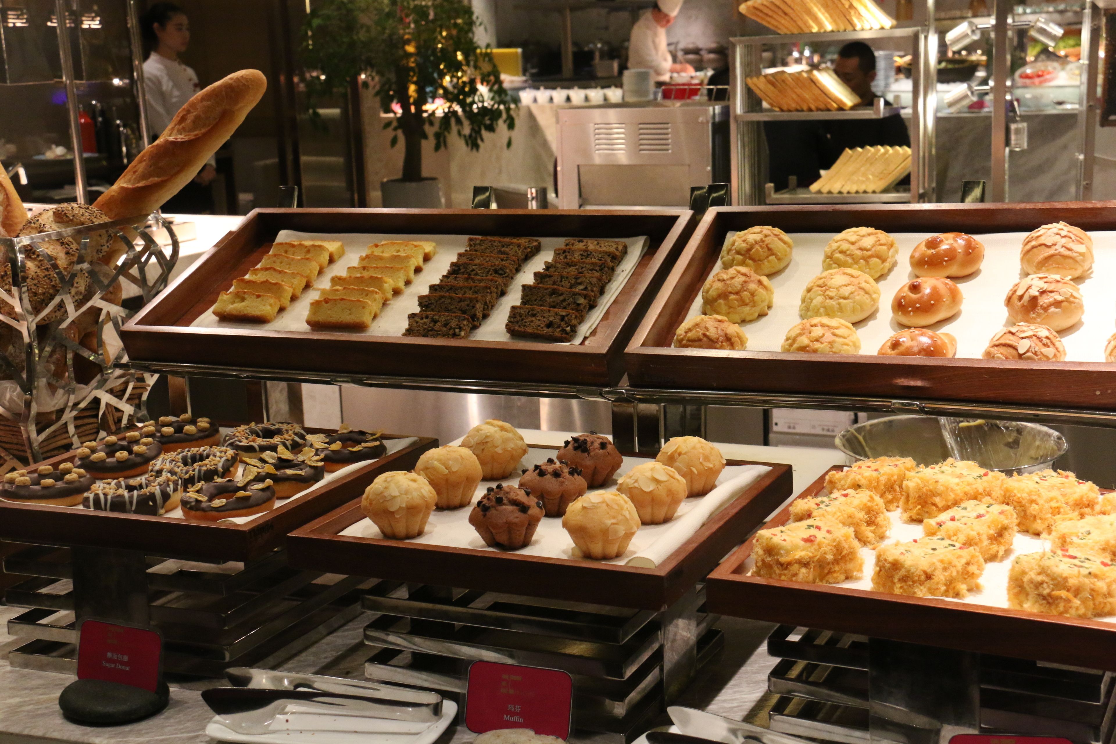 A bakery display with various baked goods.