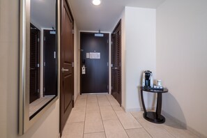 A hallway with a coffee machine and a sign on the door. - Holiday Inn Murfreesboro by IHG (Murfreesboro)