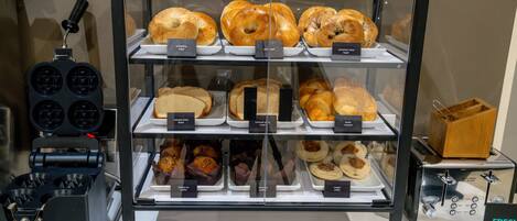 A bakery display case with various baked goods.