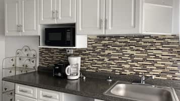 Deluxe Apartment, 2 Bedrooms, City View (No Topsheet / Towels / Paper Products) | Private kitchen | Full-size fridge, microwave, oven, stovetop