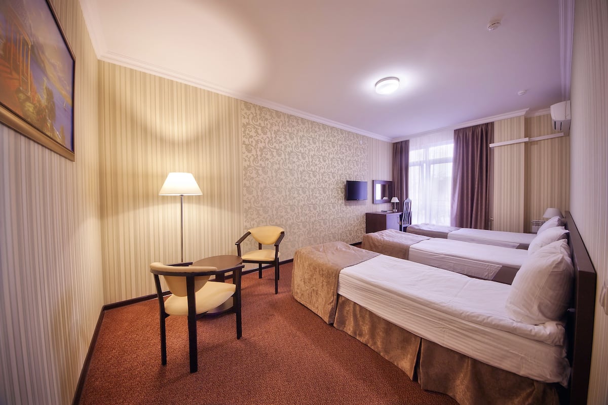 Standard Triple Room | Minibar, in-room safe, desk, blackout curtains