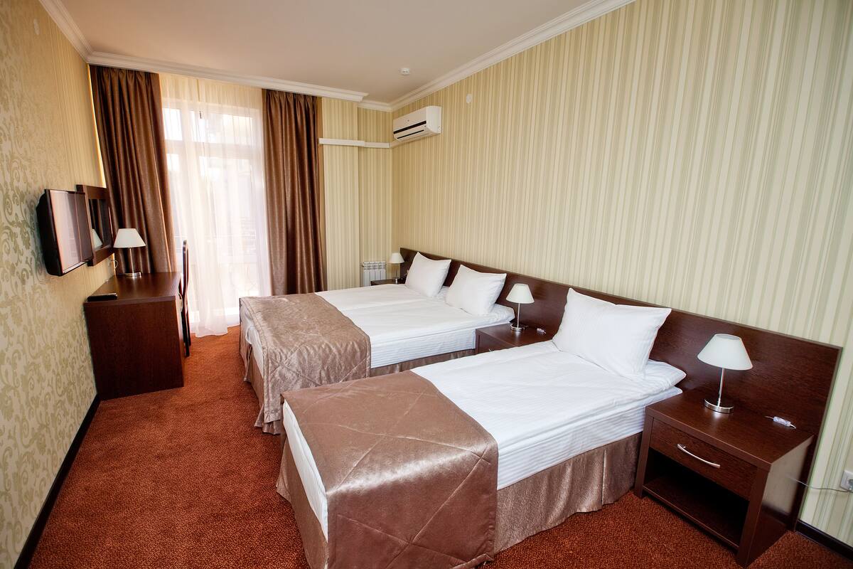 Standard Triple Room, Balcony | Minibar, in-room safe, desk, blackout curtains