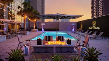 Outdoor pool, open 6:00 AM to 10:00 PM, pool umbrellas, sun loungers