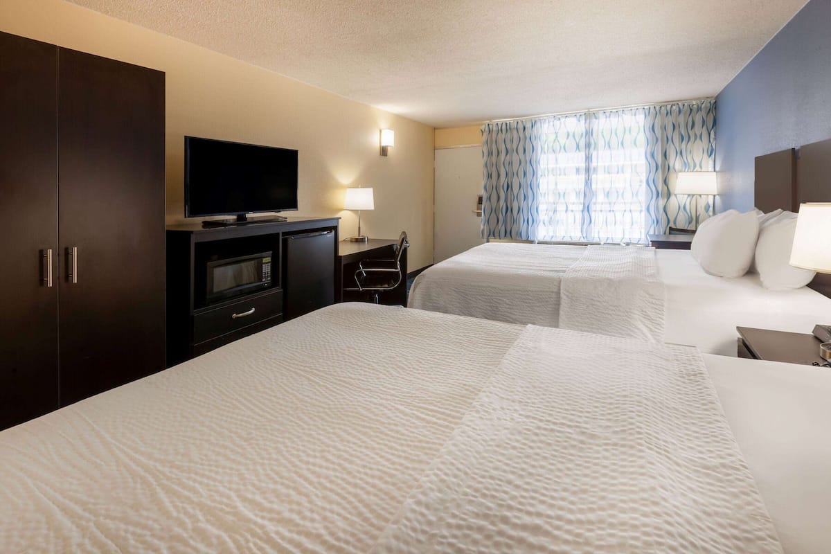 Premium bedding, pillowtop beds, desk, blackout drapes