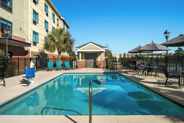 Outdoor pool, open 9 AM to 9 PM, pool umbrellas