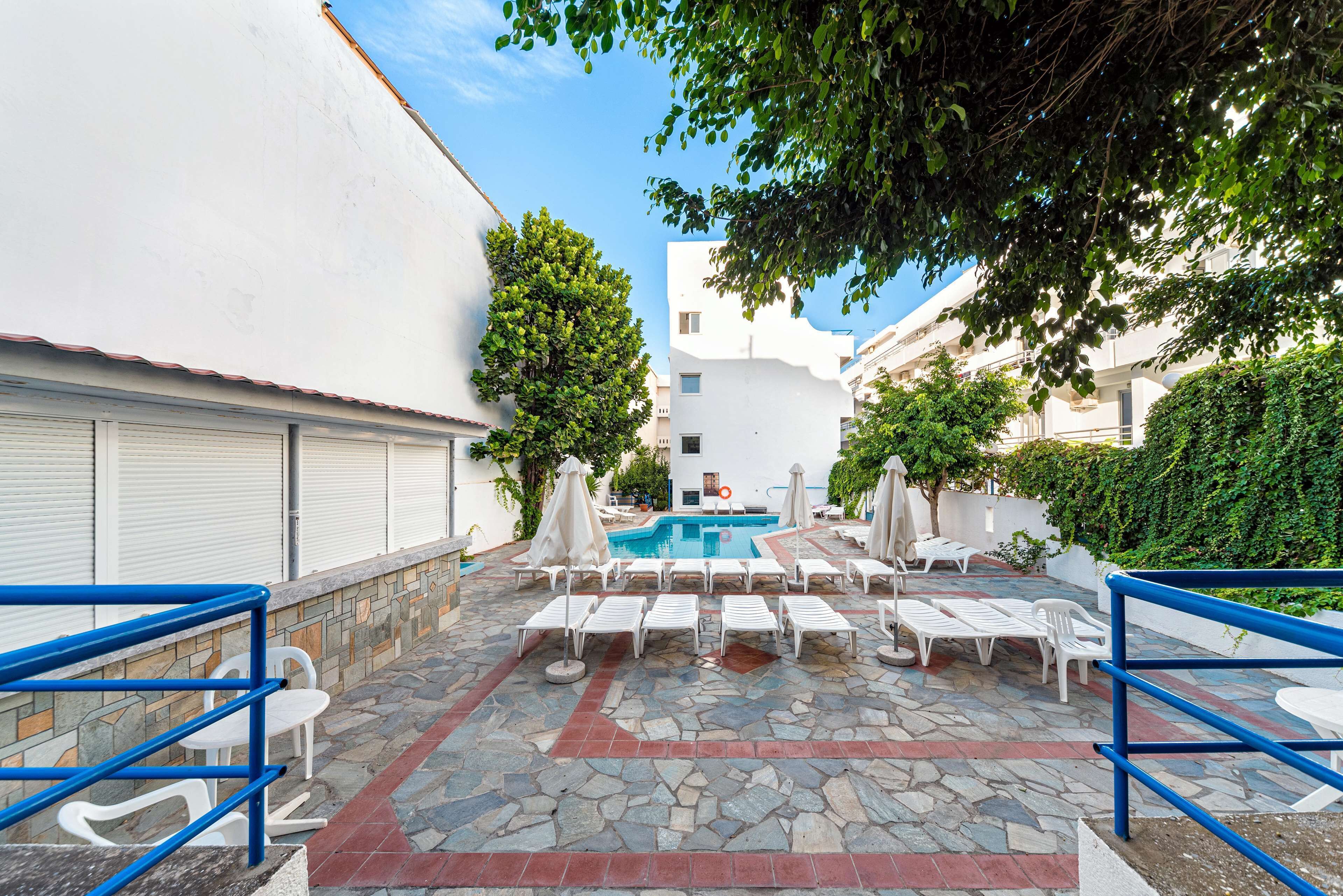 outdoor pool, pool umbrellas, pool loungers