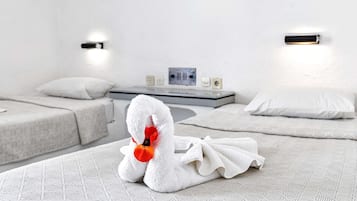 Desk, iron/ironing board, bed sheets