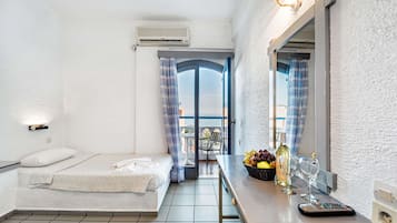 Desk, iron/ironing board, bed sheets