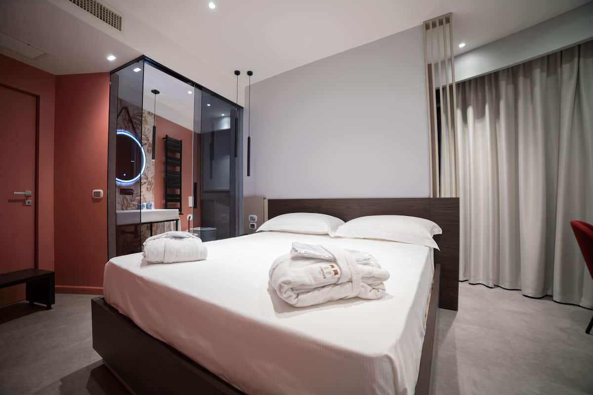 Deluxe kamer | 1 slaapkamer, luxe beddengoed, een minibar, een kluis op de kamer