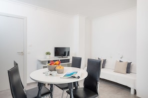 Apartment, 1 Bedroom (3 people) | Living area | 32-inch flat-screen TV with satellite channels, TV
