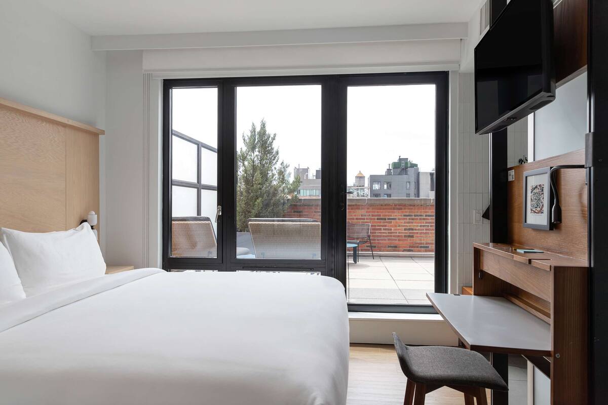 Chambre, 1 très grand lit, terrasse | Literie de qualité supérieure, couette en duvet d'oie