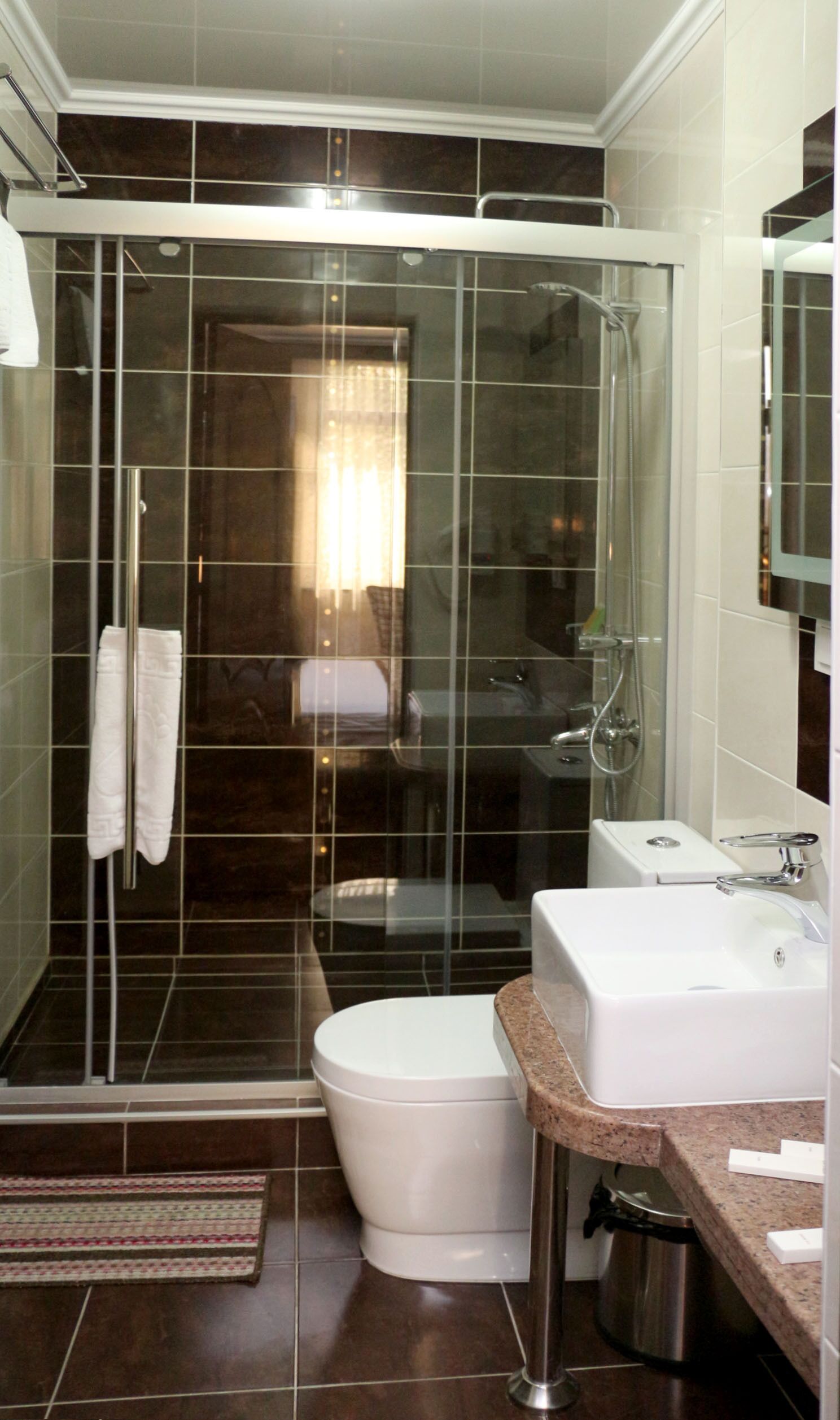 superior single room | bathroom | shower, free toiletries, hair dryer, dressing gowns
