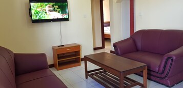 Family Apartment, 2 Bedrooms, Balcony, Pool View | Living area | 40-inch flat-screen TV with satellite channels, TV