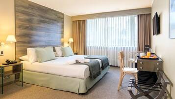 Ropa de cama de alta calidad, minibar, caja fuerte y ropa de cama