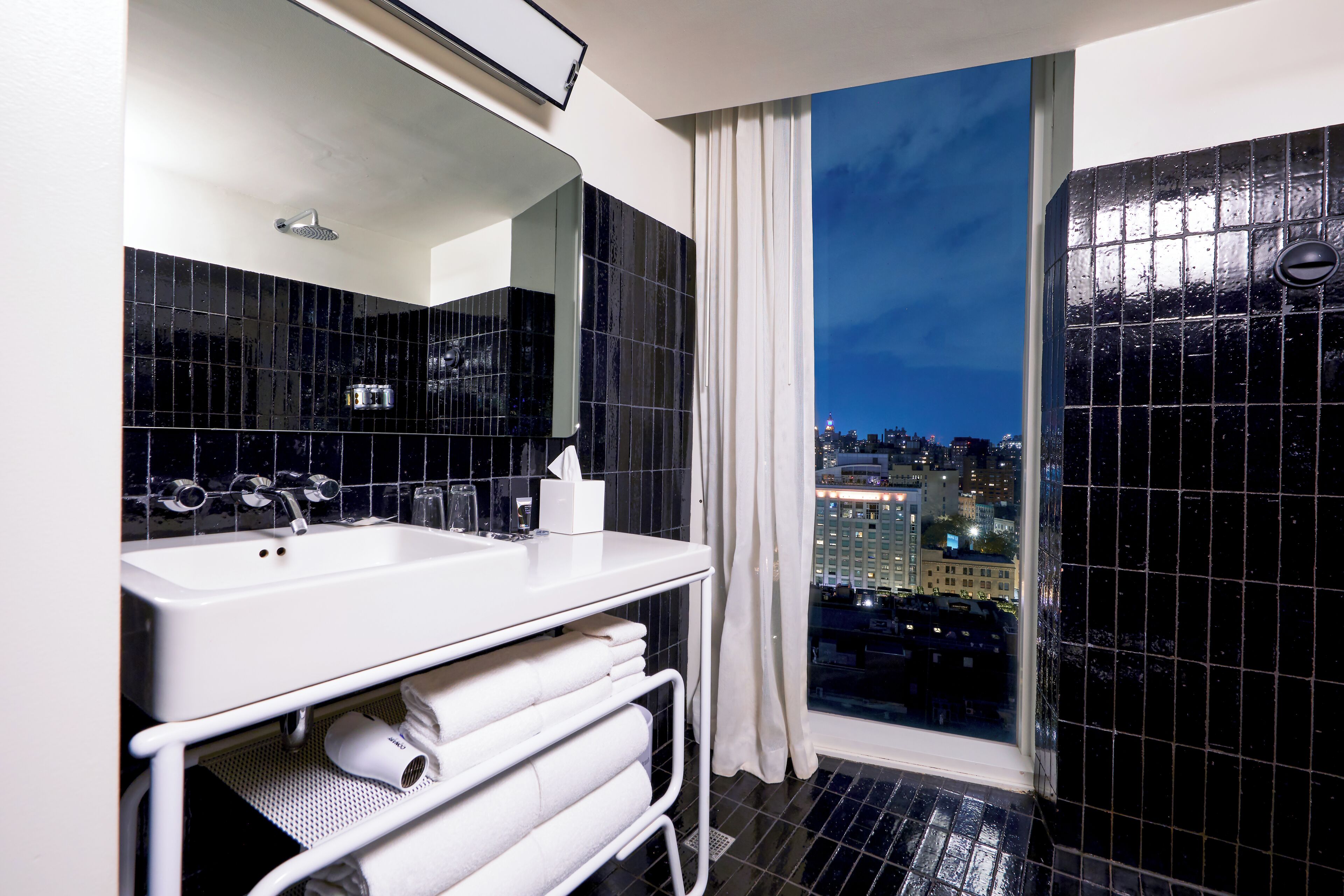 designer toiletries, hair dryer, bathrobes, towels