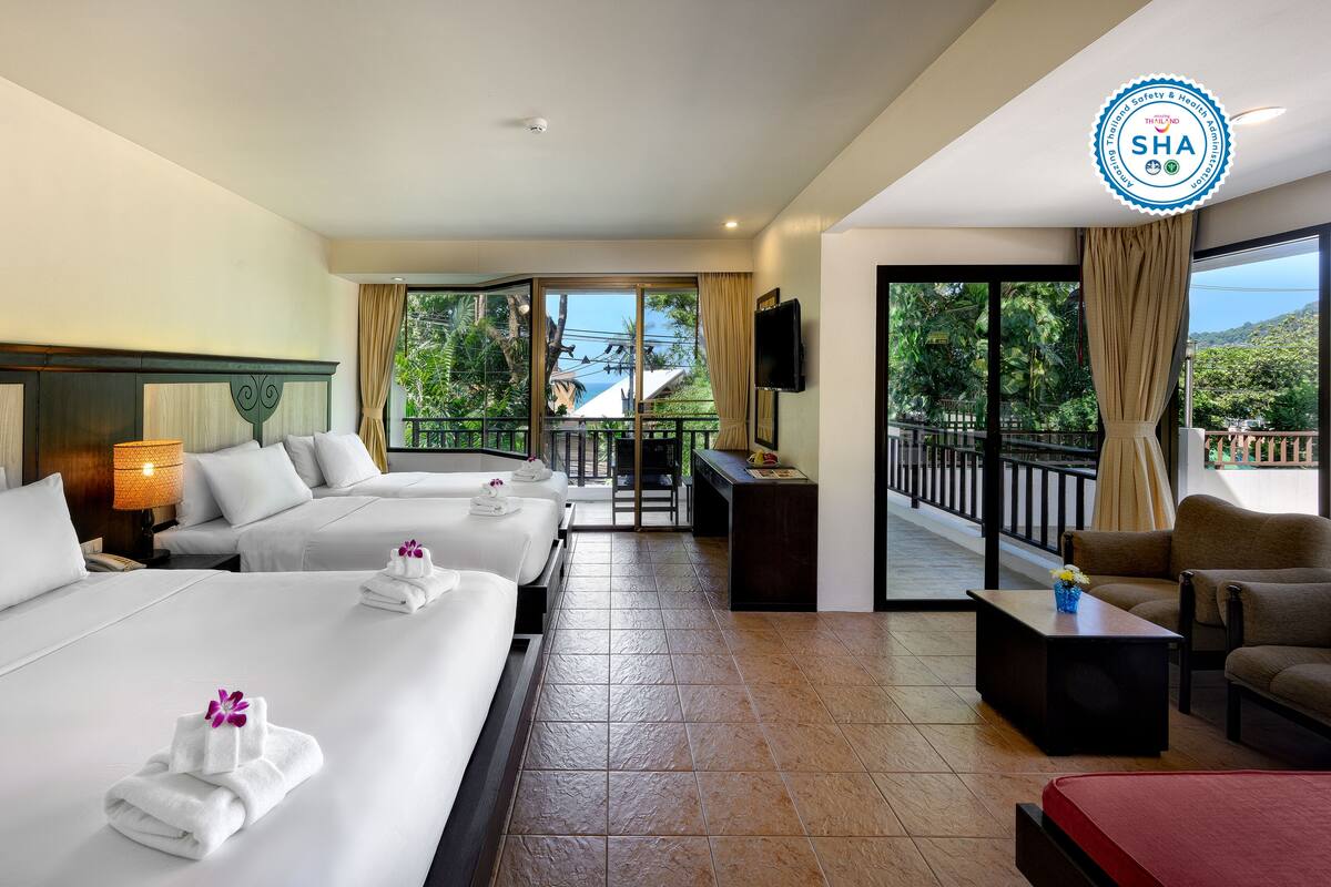 Deluxe Quadruple Room, Multiple Beds | Minibar, in-room safe, blackout drapes, iron/ironing board (on request)