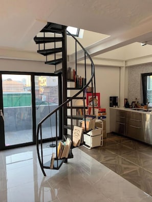 Premium Loft | Living area | Flat-screen TV, pay films