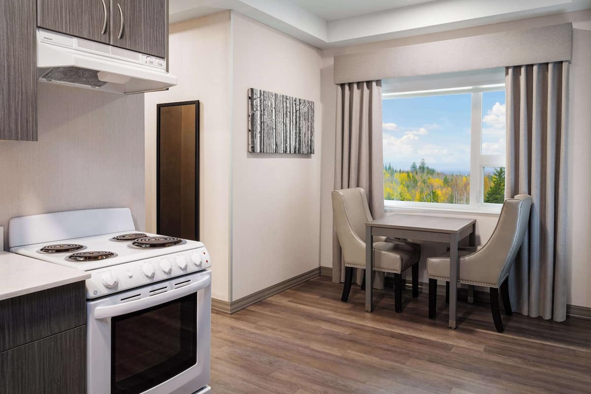 premium bedding, desk, laptop workspace, blackout curtains