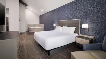 Premium bedding, desk, laptop workspace, blackout drapes