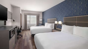 Premium bedding, desk, laptop workspace, blackout curtains