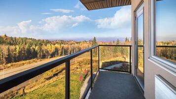 Premium bedding, desk, laptop workspace, blackout curtains