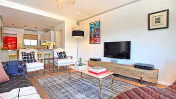 Apartment, 3 Bedrooms | Living area | Flat-screen TV, fireplace