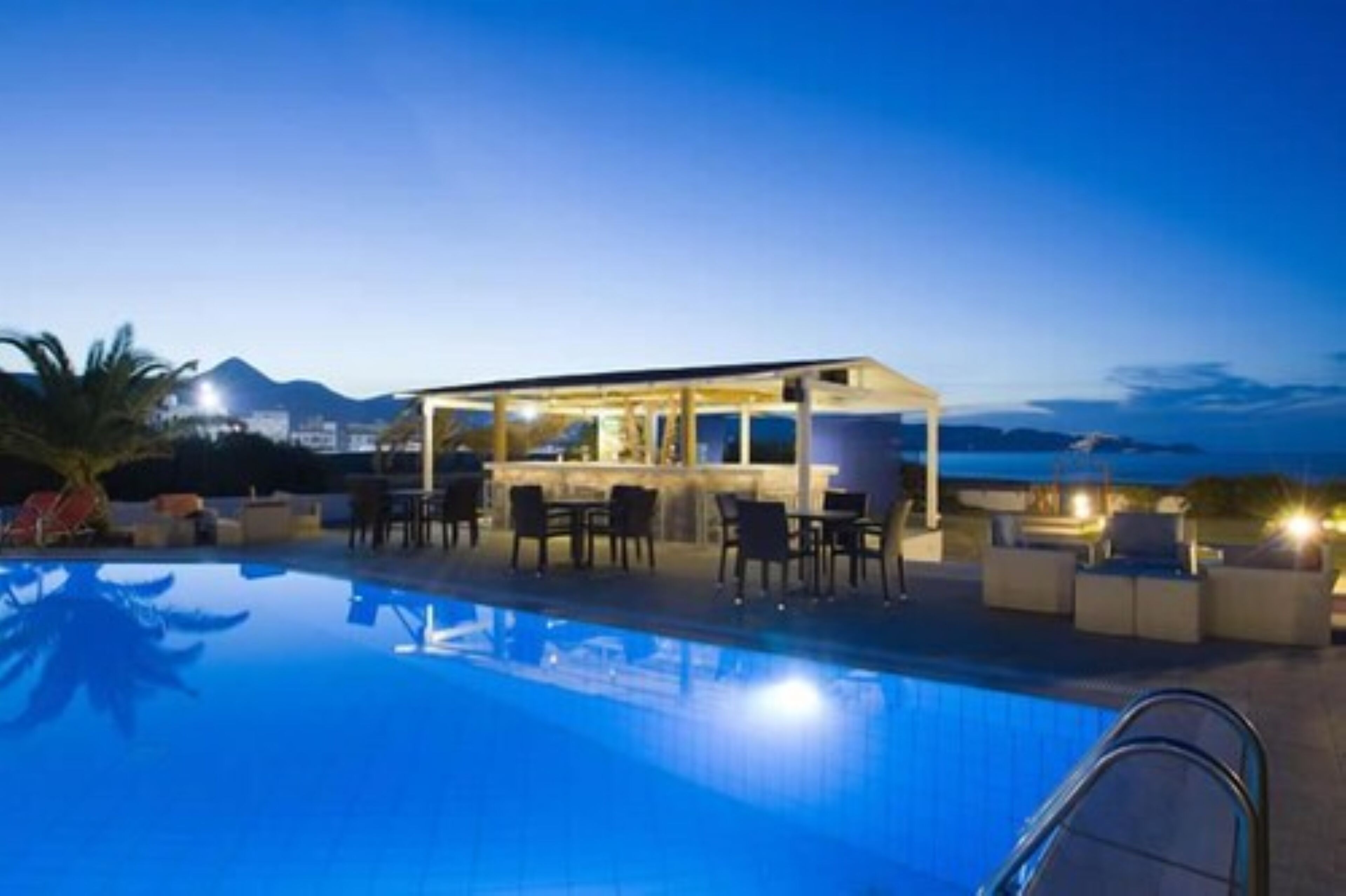 outdoor pool, pool umbrellas, pool loungers