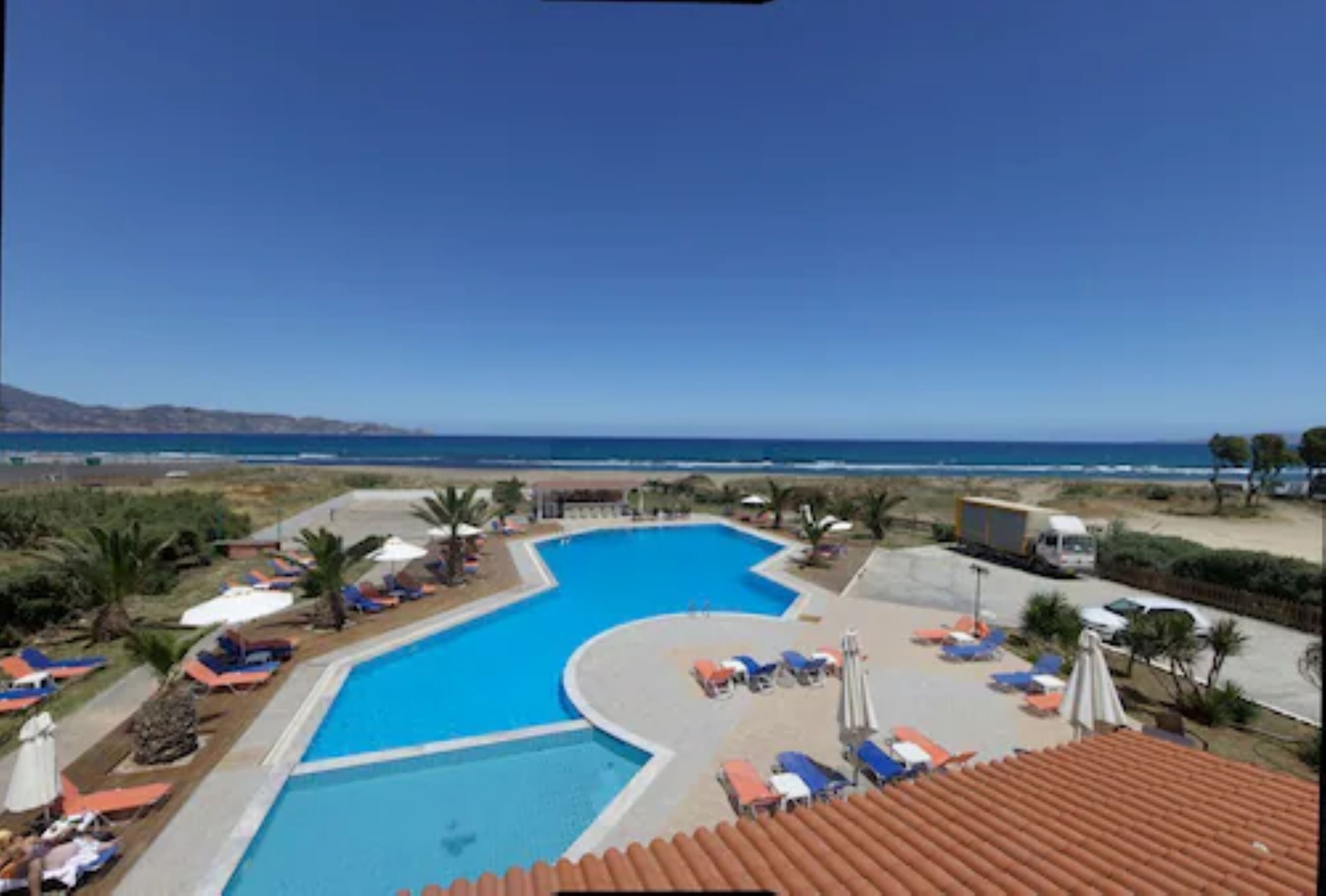 outdoor pool, pool umbrellas, pool loungers