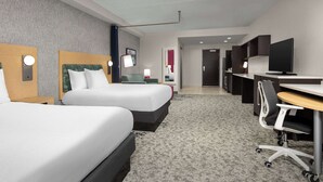 A hotel room with two beds, a desk, a chair, a television, and a bathroom visible in the background. - Home2 Suites by Hilton Knoxville West (Knoxville)