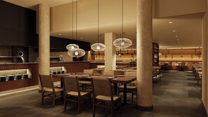 A modern restaurant interior with high ceilings, pendant lighting, and a central dining area. -  HD Sensarena - Adults Only (Teguise)