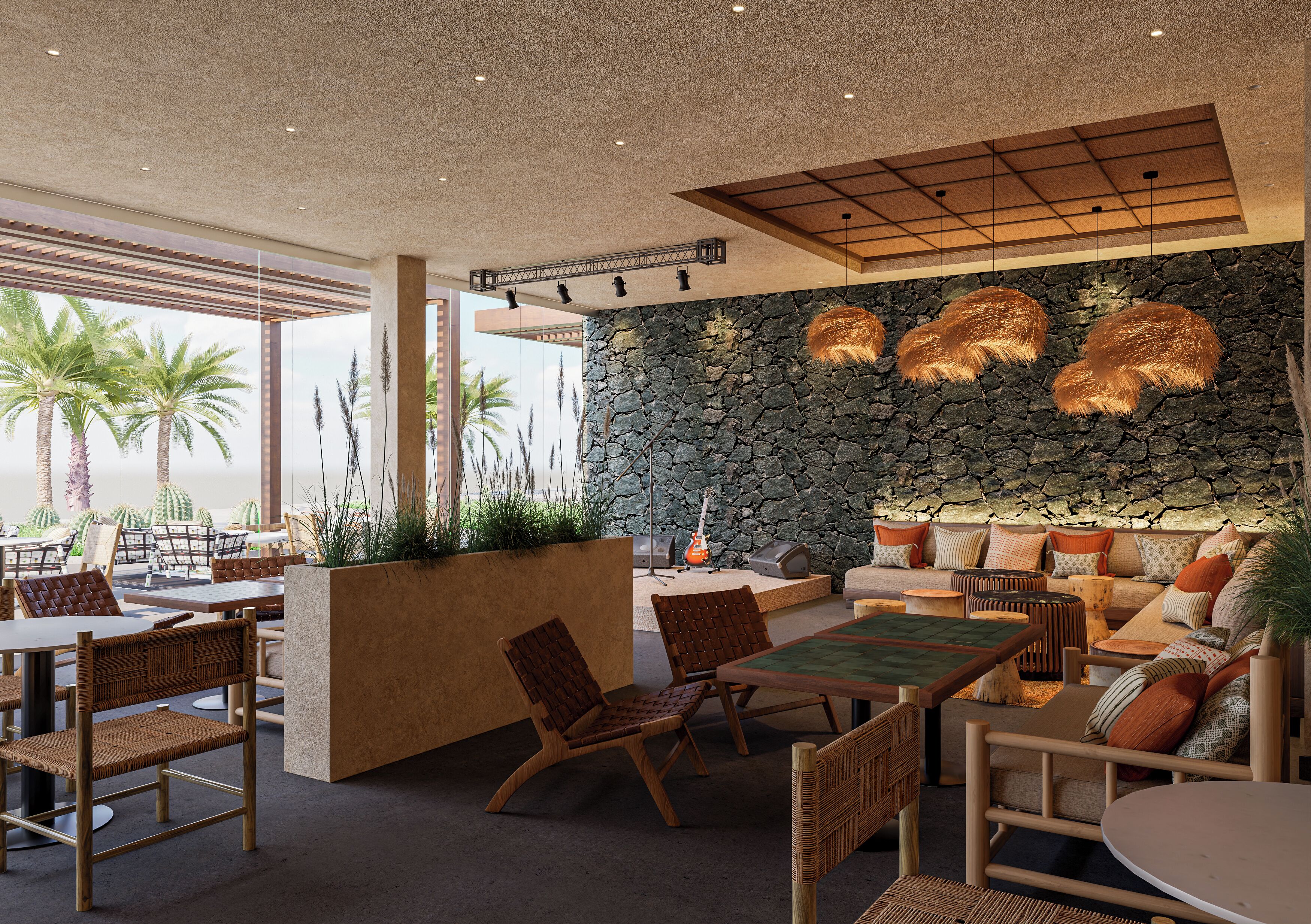 A modern outdoor seating area with stone walls, wooden furniture, and a view of palm trees.